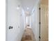 Clean hallway with tile floors and access to bedrooms at 4039 Eastridge Dr, Valrico, FL 33596
