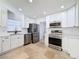 Stainless steel appliances and white shaker cabinets at 4039 Eastridge Dr, Valrico, FL 33596