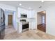 White cabinetry, stainless steel appliances, and tile flooring at 4039 Eastridge Dr, Valrico, FL 33596