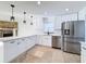 Renovated kitchen, white shaker cabinets, stainless steel appliances at 4039 Eastridge Dr, Valrico, FL 33596