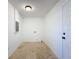 Laundry room with tile floor and electrical panel at 4039 Eastridge Dr, Valrico, FL 33596