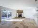 Open living room with tile floors, fireplace and sliding doors to patio at 4039 Eastridge Dr, Valrico, FL 33596
