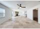 Open living room with tile floors, fireplace and sliding doors to patio at 4039 Eastridge Dr, Valrico, FL 33596