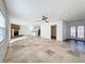 Open living room with tile floors, fireplace and sliding doors to patio at 4039 Eastridge Dr, Valrico, FL 33596