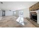 Bright living room featuring a stone fireplace and tile floors at 4039 Eastridge Dr, Valrico, FL 33596