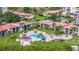 Community pool and surrounding buildings aerial view at 6219 Palma Del Mar S Blvd # 114, St Petersburg, FL 33715