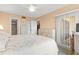 Main bedroom with king-size bed and access to the bathroom at 6219 Palma Del Mar S Blvd # 114, St Petersburg, FL 33715