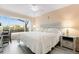 Spacious bedroom with a king-size bed and large window at 6219 Palma Del Mar S Blvd # 114, St Petersburg, FL 33715