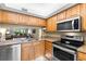 Modern kitchen featuring stainless steel appliances and granite countertops at 6219 Palma Del Mar S Blvd # 114, St Petersburg, FL 33715