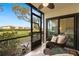 Spacious screened lanai with seating and tranquil views at 6219 Palma Del Mar S Blvd # 114, St Petersburg, FL 33715