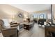 Living room features wood-look floors and comfortable seating at 6219 Palma Del Mar S Blvd # 114, St Petersburg, FL 33715