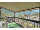 Private balcony with lush treetop views at 6311 Newtown Cir # 11B1, Tampa, FL 33615