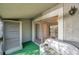 Relax on the cozy balcony, featuring sliding glass doors, and a comfortable seating arrangement at 6311 Newtown Cir # 11B1, Tampa, FL 33615