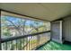 Enjoy the outdoors from this charming balcony with gorgeous views of lush greenery and a tranquil lake at 6311 Newtown Cir # 11B1, Tampa, FL 33615