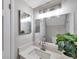 Bathroom with modern vanity and updated lighting at 6311 Newtown Cir # 11B1, Tampa, FL 33615