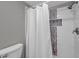 Clean bathroom with shower stall and white tile at 6311 Newtown Cir # 11B1, Tampa, FL 33615