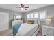 Serene bedroom with ceiling fan and plenty of storage at 6311 Newtown Cir # 11B1, Tampa, FL 33615