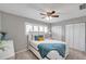 Well-lit bedroom with ceiling fan and double closets at 6311 Newtown Cir # 11B1, Tampa, FL 33615