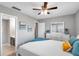 Cozy bedroom with ceiling fan and en-suite bathroom at 6311 Newtown Cir # 11B1, Tampa, FL 33615