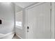 Interior entryway with white door and stairway at 6311 Newtown Cir # 11B1, Tampa, FL 33615