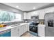 Updated kitchen with stainless steel appliances at 6311 Newtown Cir # 11B1, Tampa, FL 33615