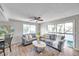 Bright living room with gray sofa, coffee table and balcony access at 6311 Newtown Cir # 11B1, Tampa, FL 33615