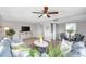 Bright living room with gray sofa, coffee table, and dining area at 6311 Newtown Cir # 11B1, Tampa, FL 33615