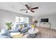 Bright living room with comfy sofa and wood-look floors at 6311 Newtown Cir # 11B1, Tampa, FL 33615