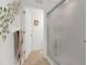 Bathroom with frosted glass shower door, tile floor, and decorative wall accents at 6363 99Th N Way # 12A, St Petersburg, FL 33708