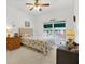 Bright bedroom with a queen-size bed, window seat, and ample closet space at 6363 99Th N Way # 12A, St Petersburg, FL 33708