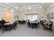 Community room with tables, chairs, and comfortable seating areas at 6363 99Th N Way # 12A, St Petersburg, FL 33708