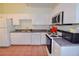 Efficient kitchen featuring white cabinets and appliances at 6363 99Th N Way # 12A, St Petersburg, FL 33708