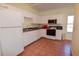 White kitchen with granite countertops and appliances at 6363 99Th N Way # 12A, St Petersburg, FL 33708