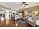Spacious living room with hardwood floors and kitchen access at 6363 99Th N Way # 12A, St Petersburg, FL 33708