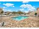 Community pool with surrounding patio and lounge chairs at 6363 99Th N Way # 12A, St Petersburg, FL 33708