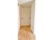 Hallway features wood-look flooring leading to several rooms in the house at 6615 Parkside Dr, New Port Richey, FL 34653