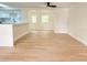 Bright open-concept living room featuring light wood flooring at 6615 Parkside Dr, New Port Richey, FL 34653