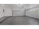 Clean and spacious garage with epoxy flooring and ample storage at 8001 Sharon Dr, Tampa, FL 33617