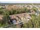 Aerial view of townhouses with brown roofs and garages at 8907 Casablanca Way, Tampa, FL 33626