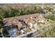 Aerial view of townhouses with brown roofs and garages at 8907 Casablanca Way, Tampa, FL 33626