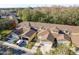 Aerial view of townhouses with brown roofs and garages at 8907 Casablanca Way, Tampa, FL 33626