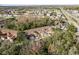 Aerial view of townhouses with brown roofs and garages at 8907 Casablanca Way, Tampa, FL 33626