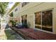 Private backyard with a wooden deck and lush greenery at 8907 Casablanca Way, Tampa, FL 33626