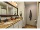 Double vanity bathroom with granite countertops and neutral color scheme at 8907 Casablanca Way, Tampa, FL 33626