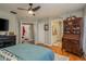 Primary bedroom with ensuite bath, hardwood floors, and walk-in closet at 8907 Casablanca Way, Tampa, FL 33626