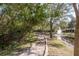 Walking path alongside a pond and lush foliage at 8907 Casablanca Way, Tampa, FL 33626