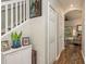 Interior hallway with hardwood floors and white doors at 8907 Casablanca Way, Tampa, FL 33626