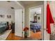 Hallway view of two bedrooms with hardwood floors and neutral walls at 8907 Casablanca Way, Tampa, FL 33626