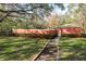 Community pool with surrounding lush landscape at 8907 Casablanca Way, Tampa, FL 33626