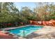 Inviting community pool with plenty of lounge chairs at 8907 Casablanca Way, Tampa, FL 33626